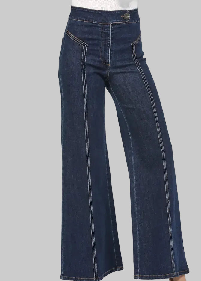 Pair of dark blue flared jeans on a white background